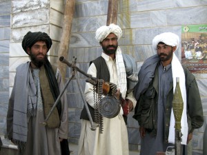 Former Taliban soldiers display their weapons during a ceremony in the western city of Herat March 10, 2009. Forty Taliban fighters surrendered to the government on Tuesday, according to local authorities. Afghanistan's Taliban on Tuesday turned down as illogical U.S. President Barack Obama's bid to reach out to moderate elements of the insurgents, saying the exit of foreign troops was the only solution for ending the war.      REUTERS/Mohammad Shoiab (AFGHANISTAN CONFLICT POLITICS)