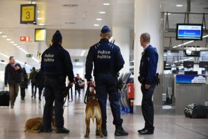 Policemen patrol during the partial reopening of the departure hall of Brussels Airport in Zaventem on May 1, 2016, after it was badly damaged in twin suicide attacks on March 22, that killed 16 people.  A total of 32 people were killed and more than 300 wounded in coordinated suicide bombings at the airport and a metro station in central Brussels on March 22 in Belgium's worst ever terror attacks. / AFP / JOHN THYS        (Photo credit should read JOHN THYS/AFP/Getty Images)