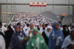 Hundreds of thousands of Muslim pilgrims make their way to cast stones at a pillar symbolizing the stoning of Satan, in a ritual called "Jamarat," the last rite of the annual hajj, on the first day of Eid al-Adha, in Mina near the holy city of Mecca, Saudi Arabia, Thursday, Sept. 24, 2015. (AP Photo/Mosa'ab Elshamy)