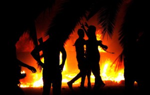 This Sept. 21, 2012 file photo shows Libyan civilians celebrate the raiding of Ansar al-Shariah Brigades compound, after hundreds of Libyans, Libyan Military, and Police raided the Brigades base, in Benghazi, Libya. Small teams of U.S. special operations forces arrived at American embassies throughout North Africa to set up a new counterterrorist network months before militants killed the U.S. ambassador in Libya. But officials say the network was too new to stop the Benghazi attack.  (AP Photo/Mohammad Hannon, File )