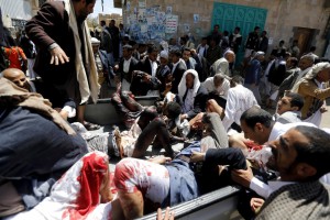 ATTENTION EDITORS - VISUAL COVERAGE OF SCENES OF INJURY OR DEATH?Injured people are carried onto a truck to be rushed to a hospital after a suicide bomb attack at a mosque in Sanaa March 20, 2015. At least 16 people were killed when suicide bombers blew themselves up in two mosques in the Yemeni capital Sanaa on Friday during noon prayers, medical sources told Reuters. The mosques are known to be used mainly by supporters of the Shi'ite Muslim Houthi group which has seized control of the government.  REUTERS/Khaled Abdullah TEMPLATE OUT