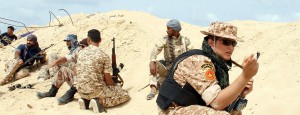 Fighters from the pro-government forces loyal to Libya's Government of National Unity (GNA) hold a position as they target the Islamic State (IS) group in Sirte with a wave of air strikes to help pave the way for ground troops to take the jihadists' coastal stronghold on June 23, 2016. The fall of Sirte would be a major blow to IS, which has faced a series of setbacks in Syria and Iraq.  / AFP / STRINGER        (Photo credit should read STRINGER/AFP/Getty Images)