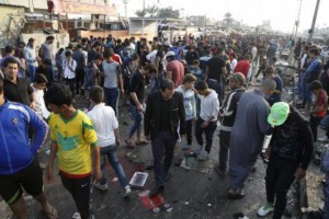 People gather at the site of suicide blasts in Baghdad's Sadr City February 28, 2016.  REUTERS/Wissm al-Okili