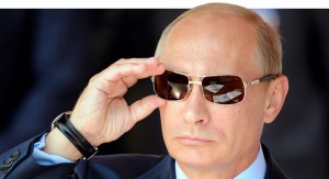 Russian Prime Minister Vladimir Putin adjusts his sunglasses as he watches an air show during MAKS-2011, the International Aviation and Space Show, in Zhukovsky, outside Moscow, on August 17, 2011. AFP PHOTO / DMITRY KOSTYUKOV (Photo credit should read DMITRY KOSTYUKOV/AFP/Getty Images)