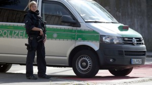 GERMANY OUT - Police standing  near the preliminary reception center for refugees in Zirndorf, Germany, Wednesday July 27,  2016. A suitcase containing a spray can exploded near a refugee center and a police station in the German state of Bavaria on Wednesday, but no one was hurt, authorities said. (Daniel Karmann/dpa via AP)