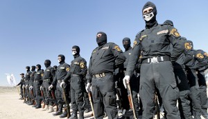 Iraqi Sunni Muslim fighters from Hashid Shaabi (Popular Mobilization) take part in a parade during a ceremony marking the Iraqi Police Day at Amiriyat al-Fallujah in Anbar province, January 9, 2016. REUTERS/Thaier Al-Sudani - RTX21NI3