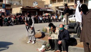 Public execution of three Syrian civilians by extremist militants in Raqqa (file photo)