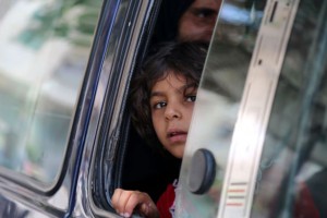 A Syrian child in a vehicle looks on in the northern Syrian town of Manbij as civilians go back to their homes on August 14, 2016 more than a week after the Arab-Kurdish alliance, known as the Syrian Democratic Forces (SDF), pushed the Islamic State (IS) group out of the city. The last remaining IS fighters abandoned the city of Manbij near the Turkish border on August 12, 2016 after a rout the Pentagon said showed the extremists were "on the ropes". The retreat from the city which IS captured in 2014 was the jihadists' worst defeat yet at the hands of the SDF backed by US air power. / AFP / DELIL SOULEIMAN        (Photo credit should read DELIL SOULEIMAN/AFP/Getty Images)