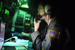 Capt. Jake Morgan, a C-130H aircraft navigator assigned to the 36th Airlift Squadron, Yokota Air Base, Japan, monitors radio traffic on approach to Tacloban Airport during Operation Damayan, Nov. 18, 2013. Operation Damayan is a humanitarian aid and disaster relief operation led by the Philippine government and supported by a multinational response force. (U.S. Air Force photo by 2nd Lt. Jake Bailey/Released)