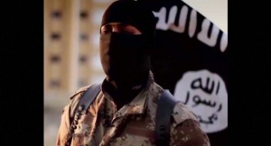 A masked man speaking in what is believed to be a North American accent in a video that Islamic State militants released in September 2014 is pictured in this still frame from video obtained by Reuters October 7, 2014. The FBI said October 7, 2014 it was seeking information on the man's identity, and issued an appeal for help in identifying individuals heading overseas to join militants in combat.  REUTERS/FBI/Handout via Reuters  (UNITED STATES - Tags: POLITICS RELIGION CONFLICT) THIS IMAGE HAS BEEN SUPPLIED BY A THIRD PARTY. IT IS DISTRIBUTED, EXACTLY AS RECEIVED BY REUTERS, AS A SERVICE TO CLIENTS. FOR EDITORIAL USE ONLY. NOT FOR SALE FOR MARKETING OR ADVERTISING CAMPAIGNS - RTR49BED