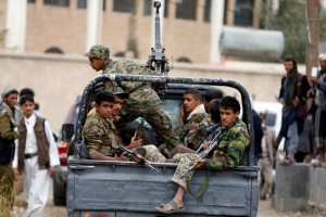 Houthi militants ride on the back of a patrol truck during a tribal gathering held to show support to the Houthi movement in Sanaa, Yemen November 10, 2016. REUTERS/Khaled Abdullah