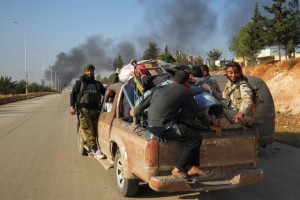 Rebel fighters ride a pick-up truck with civilians who fled areas of conflict in Dahiyet al-Assad, west Aleppo city, Syria October 30, 2016. REUTERS/Ammar Abdullah