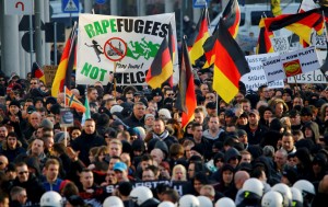 Supporters of anti-immigration right-wing movement PEGIDA protest in Cologne...Supporters of anti-immigration right-wing movement PEGIDA (Patriotic Europeans Against the Islamisation of the West) take part in in demonstration rally, in reaction to mass assaults on women on New Year's Eve, in Cologne, Germany, January 9, 2016.   REUTERS/Wolfgang Rattay ...I