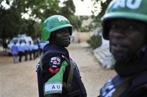 African Union Mission in Somalia (AMISOM) policemen look on they travel to General Kaahiye Police Academy to hand out supplies to the Somali police in Mogadishu, in this October 14, 2012 handout photo taken and released by the African Union-United Nations Information Support Team. REUTERS/AU-UN IST Photo/Tobin Jones/Handout